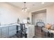 Spacious office featuring custom desk, built-ins, modern light fixture, and stylish accents at 623 E Peach Tree St, Queen Creek, AZ 85140