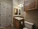 Bathroom with vanity, sink, cabinet, toilet, and tile flooring at 650 N Hawes Rd # 4406, Mesa, AZ 85207