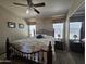 Comfortable bedroom features a ceiling fan and mirrored closet at 650 N Hawes Rd # 4406, Mesa, AZ 85207