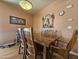 Dining area with wood table and chairs at 650 N Hawes Rd # 4406, Mesa, AZ 85207