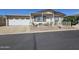 Charming single-story home with a two-car garage, front patio, and desert landscaping at 650 N Hawes Rd # 4406, Mesa, AZ 85207
