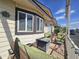 Covered patio featuring comfortable wicker furniture, perfect for relaxing outdoors at 650 N Hawes Rd # 4406, Mesa, AZ 85207