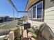 Cozy covered patio with comfortable seating and a view of the neighborhood at 650 N Hawes Rd # 4406, Mesa, AZ 85207
