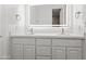 Modern bathroom featuring double sinks, quartz countertops, and an LED mirror at 6700 E Caron Dr, Paradise Valley, AZ 85253