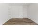 Bright bonus room with wood floors, built in shelving and 2 closet doors at 6700 E Caron Dr, Paradise Valley, AZ 85253