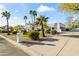 Stunning property with a two-car garage, and a meticulously landscaped front yard with mature palm trees at 6700 E Caron Dr, Paradise Valley, AZ 85253