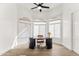 Bright home office with hardwood floors, arched windows and natural light at 6700 E Caron Dr, Paradise Valley, AZ 85253