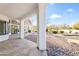 Covered patio with decorative rocks provides access to a backyard pool and a serene outdoor living space at 6700 E Caron Dr, Paradise Valley, AZ 85253