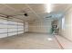 Spacious two-car garage with automatic door, finished drywall and concrete flooring at 701 Dylan Ct, Wickenburg, AZ 85390
