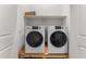 Convenient laundry room features modern, white washer and dryer at 701 Dylan Ct, Wickenburg, AZ 85390