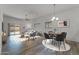 Bright living room featuring a modern decor, wood floors, and sliding glass doors to the backyard at 701 Dylan Ct, Wickenburg, AZ 85390