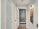 Hallway leading to a modern bathroom with a glass-enclosed shower at 7151 E Rancho Vista Dr # 1003, Scottsdale, AZ 85251