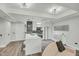 The modern kitchen features an island with seating and a black and white backsplash that opens to the living room at 7151 E Rancho Vista Dr # 1003, Scottsdale, AZ 85251