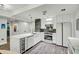 Bright, modern kitchen with a large island, stainless steel appliances and a sleek, built-in wine fridge at 7151 E Rancho Vista Dr # 1003, Scottsdale, AZ 85251