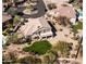 Desert home with a lush green yard and tile roof in a beautiful community at 7424 E Sandia Cir, Mesa, AZ 85207