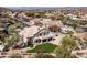 Aerial view of a home in a quiet neighborhood with mature trees and well-kept lawns at 7424 E Sandia Cir, Mesa, AZ 85207