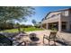 The backyard boasts a patio, chairs, and a firepit; the perfect outdoor retreat at 7424 E Sandia Cir, Mesa, AZ 85207