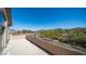 Balcony with beautiful views to desert landscape and red rock mountain backdrop at 7424 E Sandia Cir, Mesa, AZ 85207