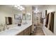 The bathroom has a dual sink vanity with granite countertops and a separate shower area for convenience at 7424 E Sandia Cir, Mesa, AZ 85207
