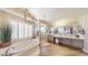 Bright bathroom featuring a soaking tub, a walk-in shower, and a dual vanity at 7424 E Sandia Cir, Mesa, AZ 85207