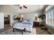 Bright and open bedroom with vaulted ceilings, plantation shutters, and views to office at 7424 E Sandia Cir, Mesa, AZ 85207