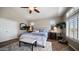 Bright and open bedroom with vaulted ceilings, plantation shutters, and views to office at 7424 E Sandia Cir, Mesa, AZ 85207