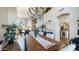 Elegant dining room boasts a decorative chandelier and wood table with seating for six at 7424 E Sandia Cir, Mesa, AZ 85207