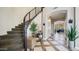 Elegant foyer with a staircase, stylish flooring, and contemporary decor at 7424 E Sandia Cir, Mesa, AZ 85207