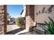 Charming porch with stone accents, seating, and decorative wall art at 7424 E Sandia Cir, Mesa, AZ 85207