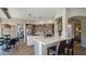 Spacious kitchen featuring stainless steel appliances, stone countertops, and an island with cooktop at 7424 E Sandia Cir, Mesa, AZ 85207