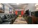Media room with reclining leather seats, mounted flat screen tv and striped accent walls at 7424 E Sandia Cir, Mesa, AZ 85207