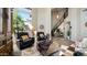 Bright living room featuring high ceilings, large windows, and comfortable seating at 7424 E Sandia Cir, Mesa, AZ 85207