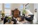 Spacious living room with large windows, comfortable seating, and stylish decor at 7424 E Sandia Cir, Mesa, AZ 85207