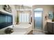 The main bathroom features a luxurious tub, shower, and a neutral color palette for a calming, spa-like feel at 7424 E Sandia Cir, Mesa, AZ 85207
