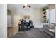 Comfortable home office space with a desk, chair, built-in shelves, and sofa at 7424 E Sandia Cir, Mesa, AZ 85207