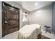 Interior view of a spa/treatment room with exam table and dark wooden door at 7424 E Sandia Cir, Mesa, AZ 85207