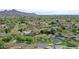 Overhead view of a property in a mature neighborhood with lots of trees and nearby mountain views at 7801 N 4Th Pl, Phoenix, AZ 85020