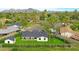 Expansive aerial view of a home, showcasing lush landscaping and nearby mountain views at 7801 N 4Th Pl, Phoenix, AZ 85020