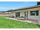 Covered back patio features a dining table and lounge seating, perfect for entertaining guests at 7801 N 4Th Pl, Phoenix, AZ 85020
