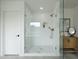 Modern bathroom showcasing glass shower and gold fixtures with a decorative vanity at 7801 N 4Th Pl, Phoenix, AZ 85020