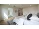 Bedroom featuring neutral color palette, hardwood floors and ensuite bathroom entrance at 7801 N 4Th Pl, Phoenix, AZ 85020