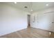 Minimalist bedroom with hardwood floors, white walls and closet at 7801 N 4Th Pl, Phoenix, AZ 85020