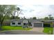 Charming single-story home with manicured lawn, two-car garage, and inviting front entrance at 7801 N 4Th Pl, Phoenix, AZ 85020