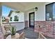 Cozy front porch featuring stylish seating, brick accents, and a welcoming entrance at 7801 N 4Th Pl, Phoenix, AZ 85020