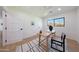 Bright home office with hardwood floors, wooden desk, neutral color palette and natural light at 7801 N 4Th Pl, Phoenix, AZ 85020