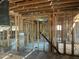 Exposed wood framing of interior under construction with light streaming from exterior windows at 7801 N 4Th Pl, Phoenix, AZ 85020