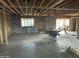 Unfinished interior of a new home with exposed ceiling, walls, and cement floor at 7801 N 4Th Pl, Phoenix, AZ 85020