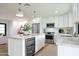 Modern kitchen boasts stainless steel appliances, a wine fridge and white cabinets at 7801 N 4Th Pl, Phoenix, AZ 85020