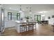 Bright, modern kitchen with a large island, stainless steel appliances, and stylish pendant lighting at 7801 N 4Th Pl, Phoenix, AZ 85020