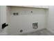 A clean laundry room with hookups and outlets ready for the washer and dryer to be installed at 7801 N 4Th Pl, Phoenix, AZ 85020